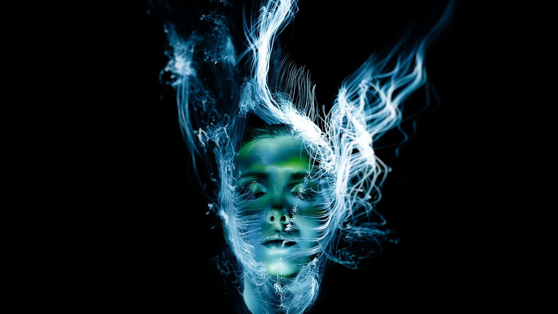 Abstract silhouette of a person in a dynamic fluid motion.