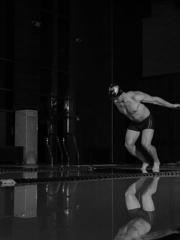 Person in a focused stance, preparing for an exercise.